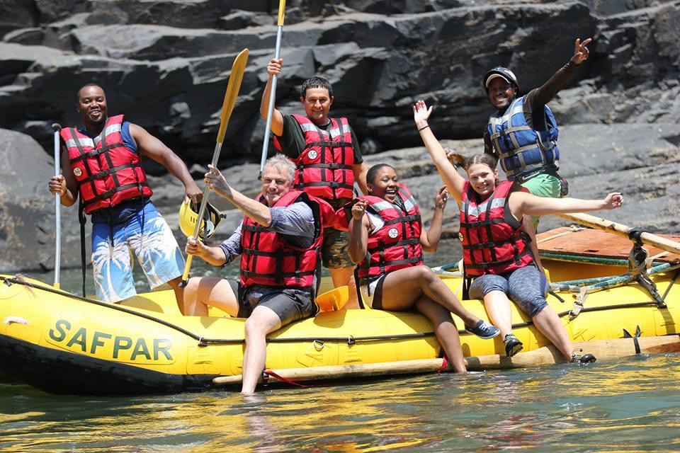 Rafting group celebrating in the Batoka Gorge on the Zambezi River